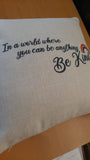 IN A WORLD WHERE YOU CAN BE ANYTHING, BE KIND - RAINBOW CUSHION