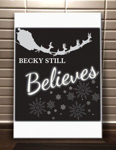 CC05 - Personalised Christmas Name inserted Still Believes Canvas Print.  Available in Black and Red.