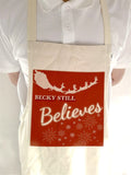 CC05 - Personalised Christmas Name inserted Still Believes Canvas Apron in Black or Red