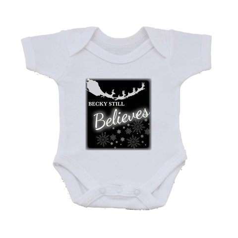 CC05 - Personalised Christmas Name inserted Still Believes in Black or Red Baby Vest