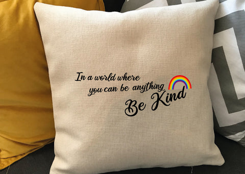 IN A WORLD WHERE YOU CAN BE ANYTHING, BE KIND - RAINBOW CUSHION