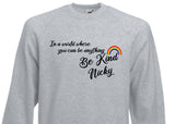 IN A WORLD WHERE YOU CAN BE ANYTHING, BE KIND - RAINBOW SWEATER