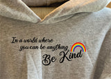 IN A WORLD WHERE YOU CAN BE ANYTHING, BE KIND - RAINBOW HOODIES