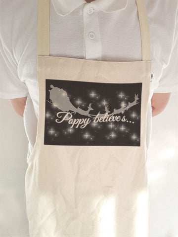 PC07 - Personalised Christmas (name inserted) Believes Canvas Apron in Black or Red