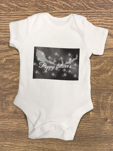 PC07 - Personalised Christmas (name inserted) Believes Baby Vest in Black or Red